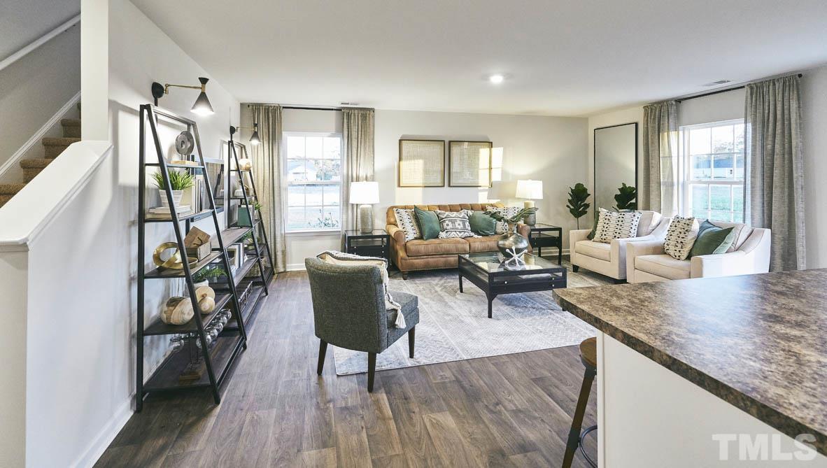 4032 Water Wheel Road Rocky Mount, NC 27803 - Photo 7 of 29 a living room with furniture and a wooden floor