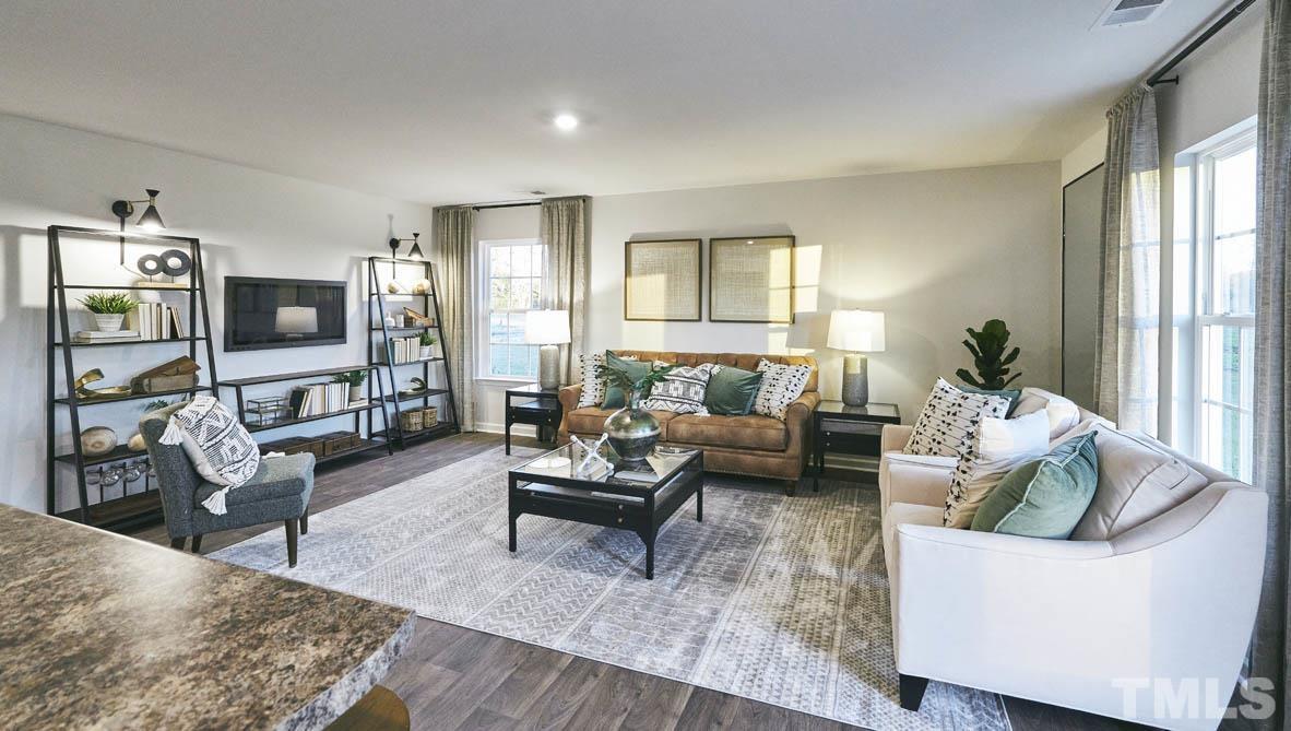 4032 Water Wheel Road Rocky Mount, NC 27803 - Photo 9 of 29 a living room with furniture and a flat screen tv