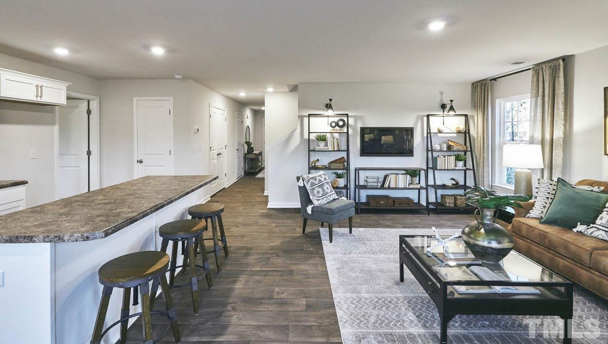 4032 Water Wheel Road Rocky Mount, NC 27803 - Photo 10 of 29 a living room with furniture and wooden floor