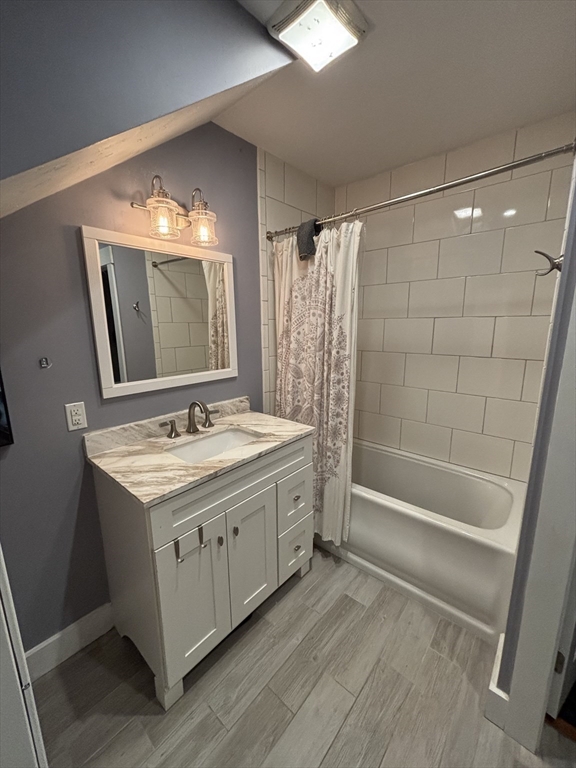 19 Aldena Road Worcester, MA 01603 - Photo 9 of 15 a bathroom with a sink a mirror and a bathtub