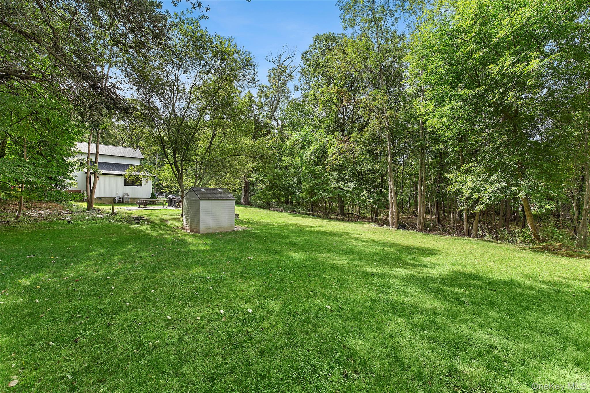 73175 Main Road Greenport, NY 11944 - Photo 15 of 15 View of green lawn featuring a shed