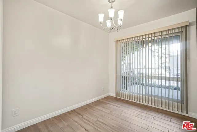 a view of a chair and table in the balcony