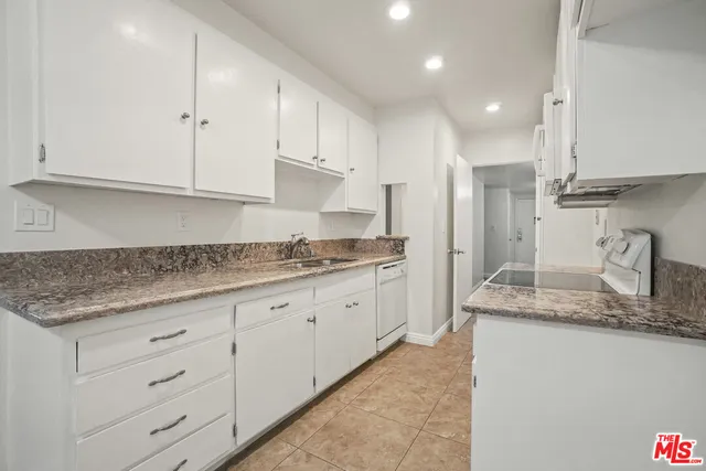 a dining room with furniture a wooden floor and chandelier