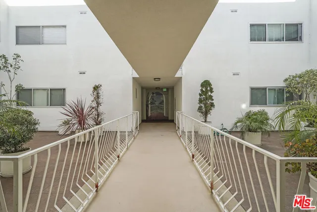 a bathroom with a mirror a sink and a mirror