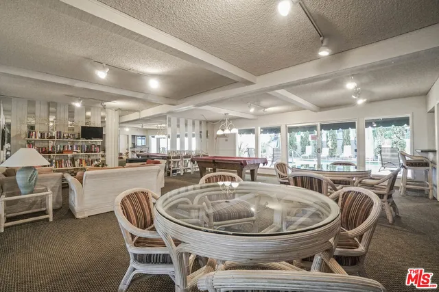 a kitchen with a refrigerator and a stove