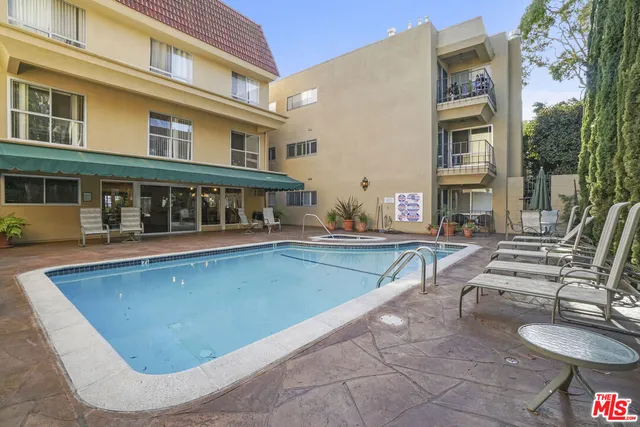 a front view of a house with large windows