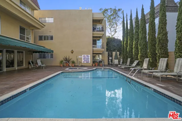 a swimming pool with outdoor seating