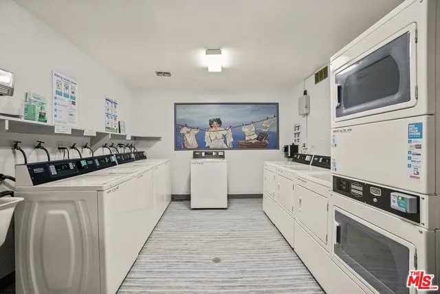 a living room with fireplace furniture and a flat screen tv