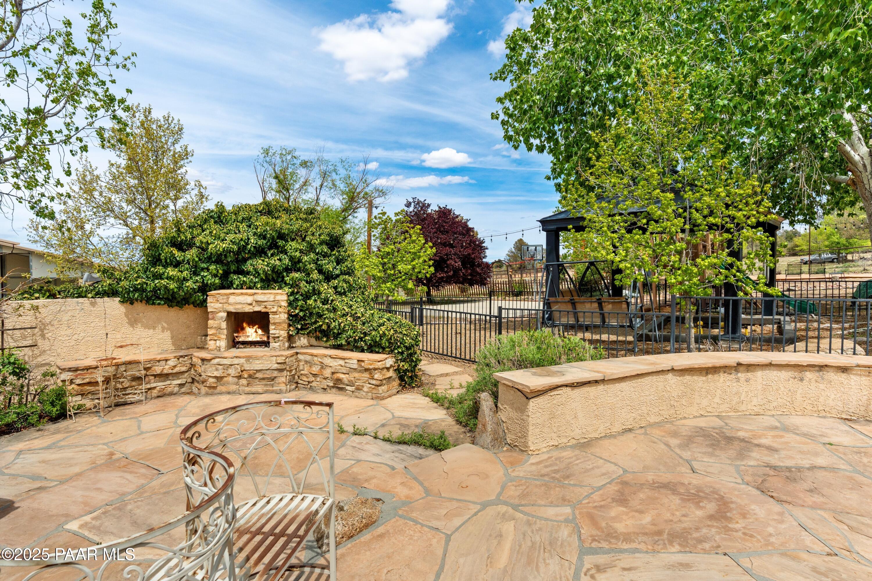 1530 West Ridge Drive Prescott, AZ 86305 - Photo 52 of 71 052_Lower Level Patio Area with Fire