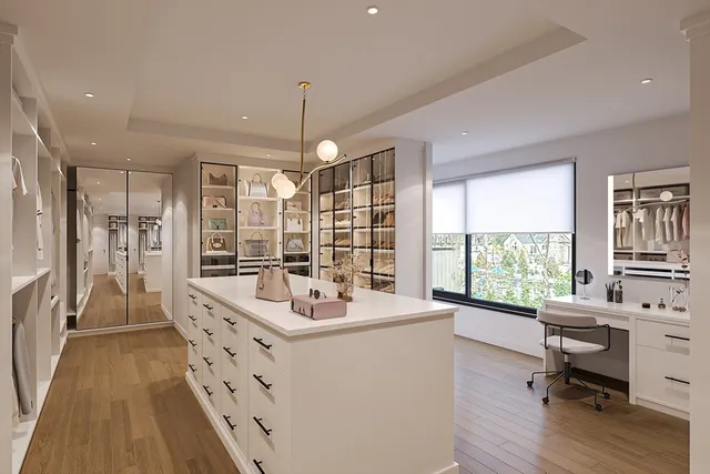 a room with stainless steel appliances furniture a rug and a large window