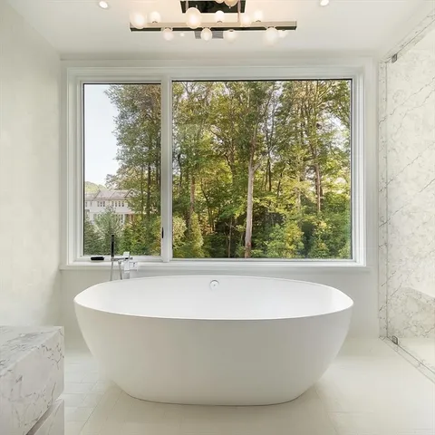 a white bath tub sitting in a bathroom
