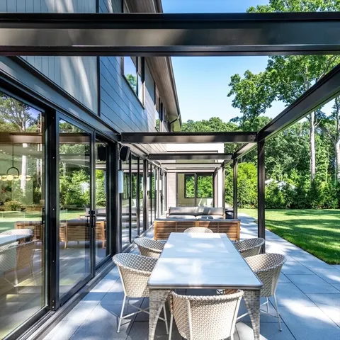 a dining room with a table and chairs