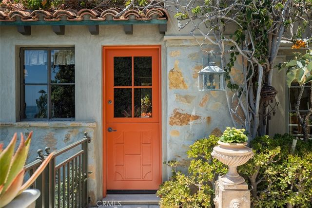 a view of a house with a potted plant and a potted plant