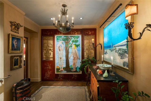 a bedroom with furniture and a large window