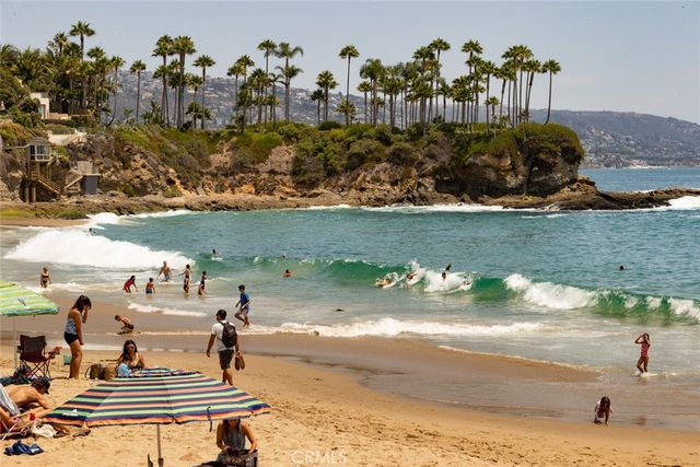 a living room with furniture and floor to ceiling window