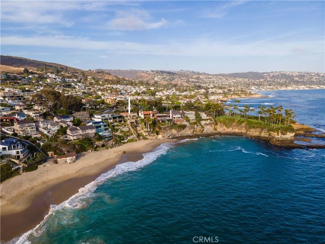 a balcony with table and chairs