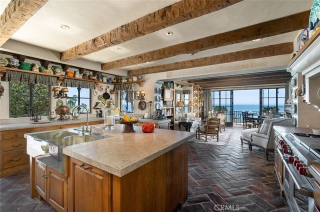 a view of a dining hall with couches and wooden floor