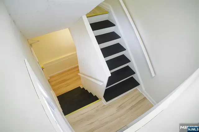an entryway in a house with wooden floor