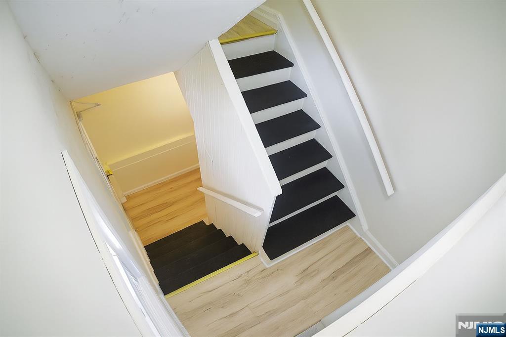 100 Rosa Parks Boulevard, Unit B1B Paterson, NJ 07501 - Photo 8 of 10 an entryway in a house with wooden floor