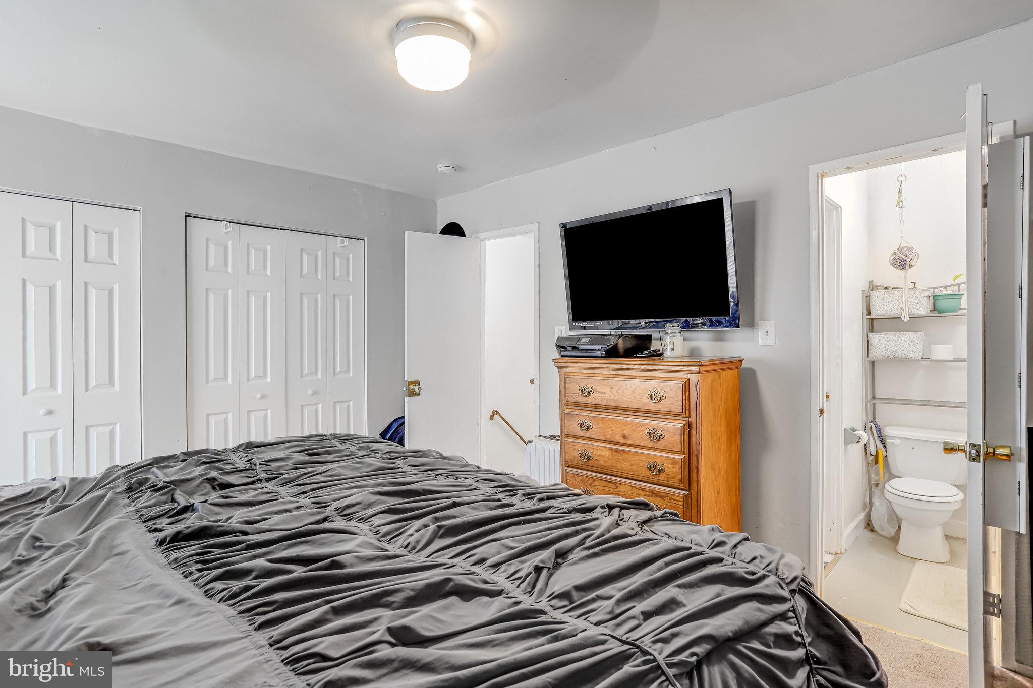 24 Mountaingate Drive Frederick, MD 21703 - Photo 23 of 32 a bedroom with a bed and a flat screen tv