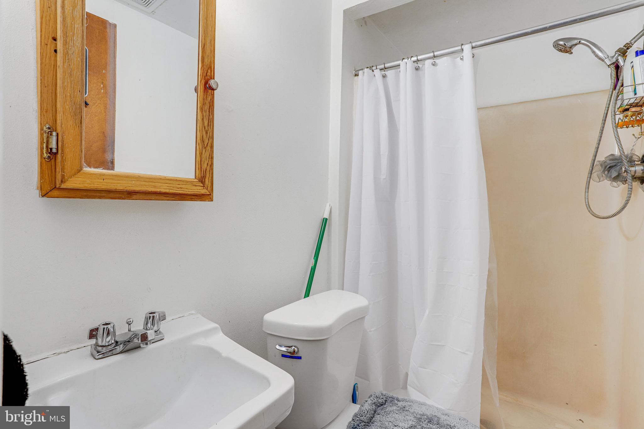 24 Mountaingate Drive Frederick, MD 21703 - Photo 24 of 32 a bathroom with a sink and a toilet