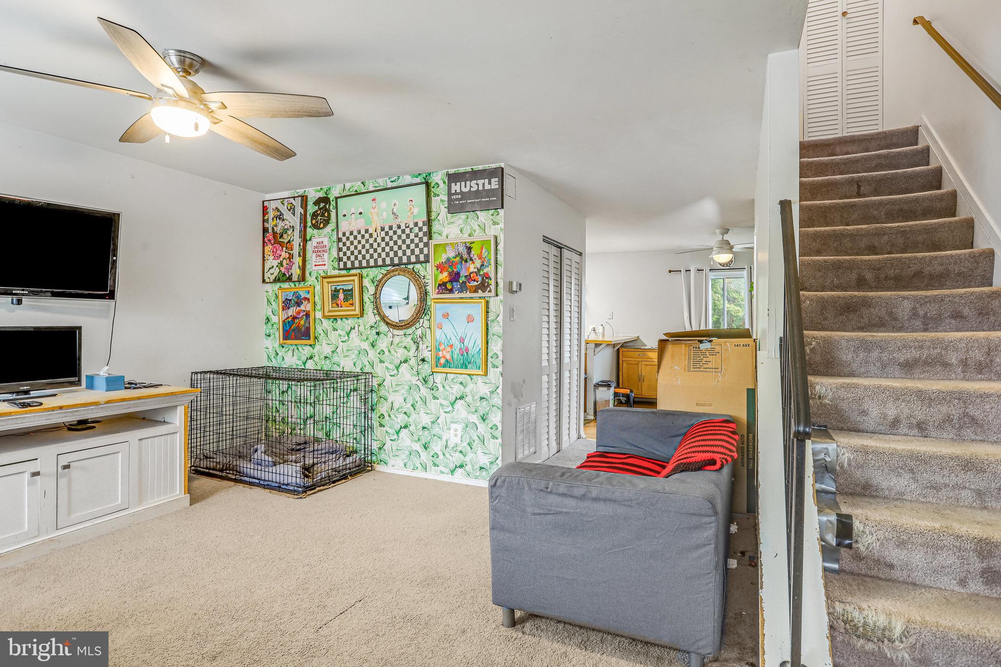 24 Mountaingate Drive Frederick, MD 21703 - Photo 4 of 32 a living room with furniture and a flat screen tv
