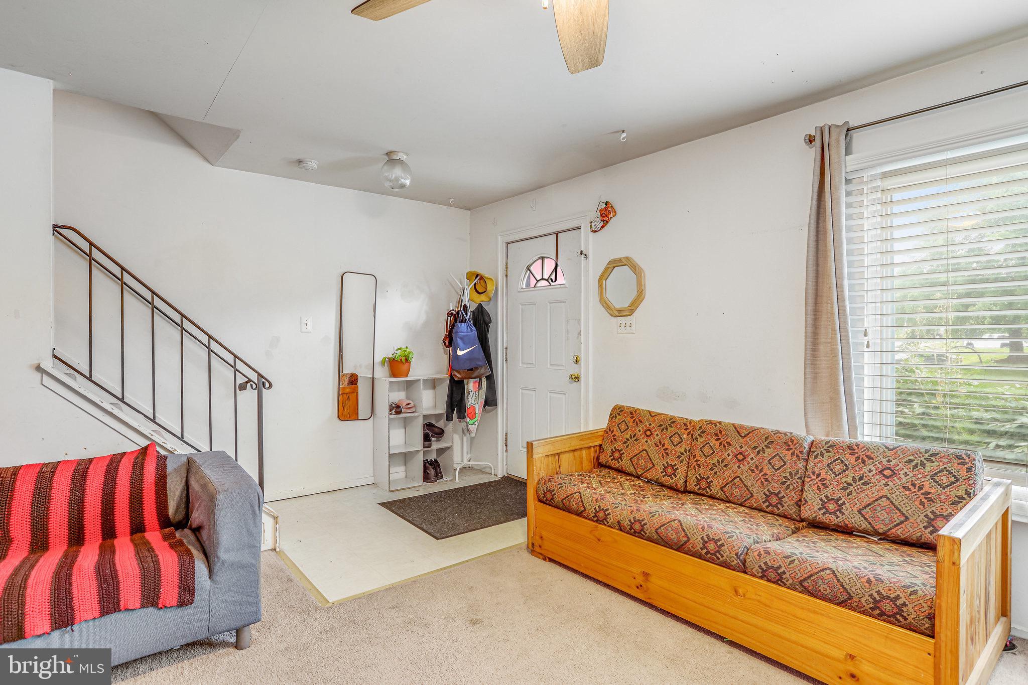24 Mountaingate Drive Frederick, MD 21703 - Photo 8 of 32 a living room with furniture fireplace and a window