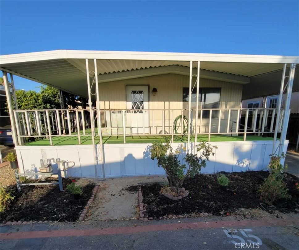 a view of a house with a small yard