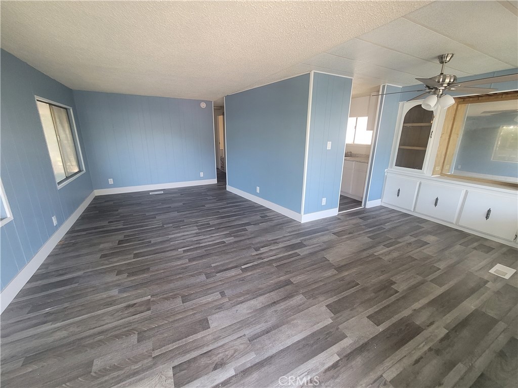 18151 Valley Boulevard, Unit 55 La Puente, CA 91744 - Photo 13 of 38 a view of a big room with wooden floor and windows