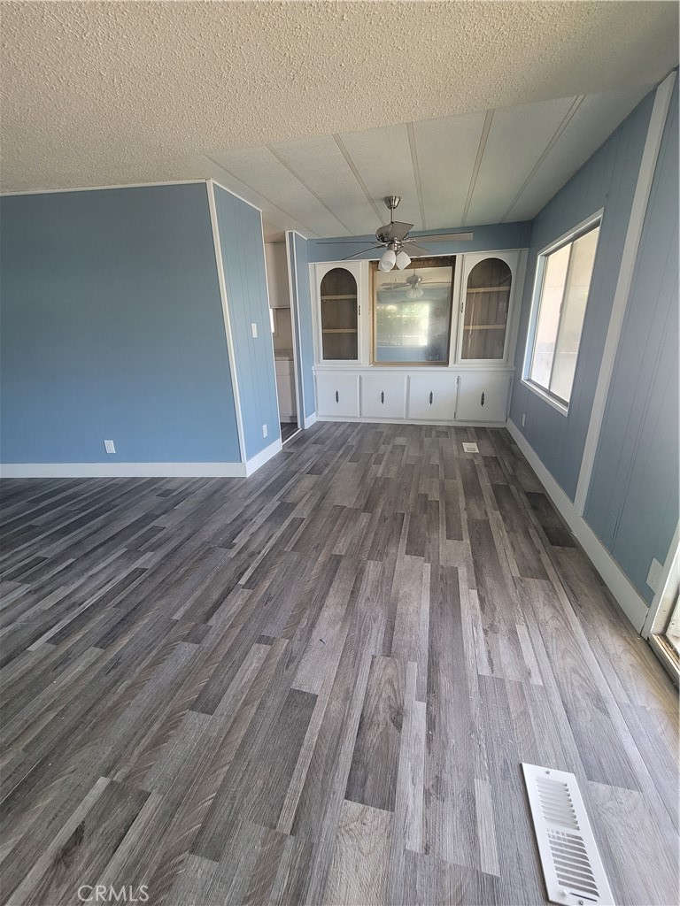 18151 Valley Boulevard, Unit 55 La Puente, CA 91744 - Photo 14 of 38 wooden floor in an empty room with a window