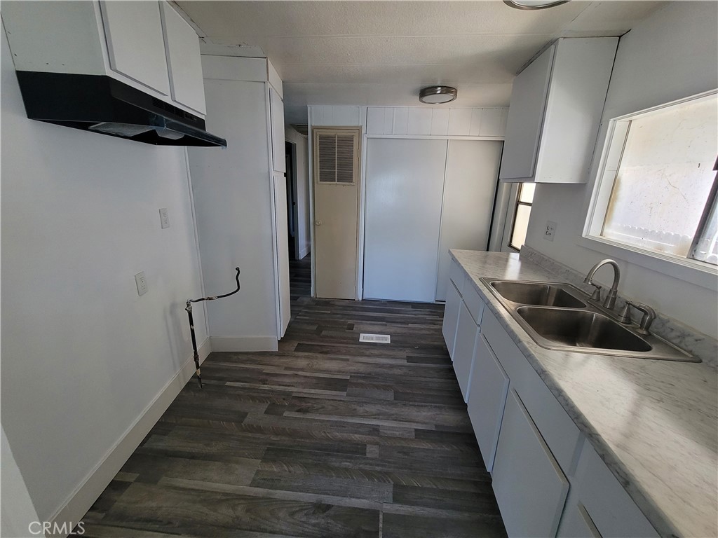 18151 Valley Boulevard, Unit 55 La Puente, CA 91744 - Photo 21 of 38 a bathroom with a sink and mirror