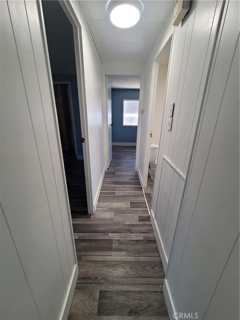 18151 Valley Boulevard, Unit 55 La Puente, CA 91744 - Photo 26 of 38 a view of a hallway to a house