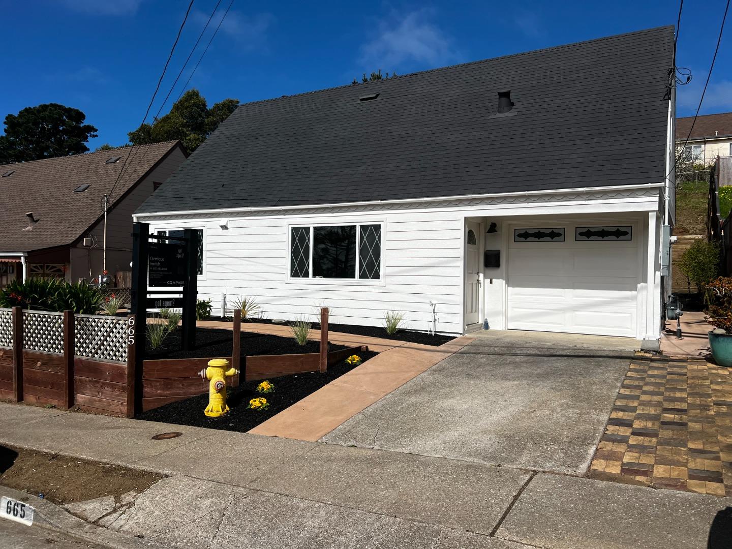 665 Southmoor Drive Pacifica, CA 94044 - Photo 1 of 1 a black car parked in front of house