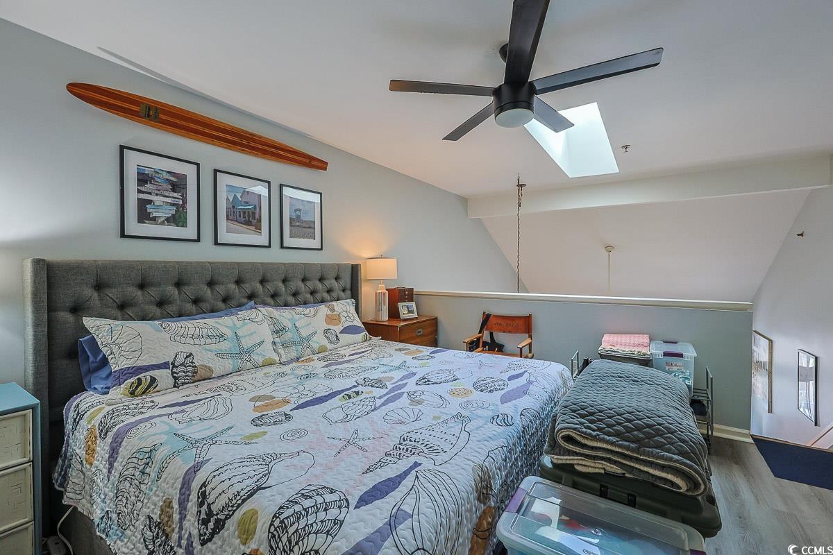1100 Possum Trot Road, Unit G324 North Myrtle Beach, SC 29582 - Photo 16 of 28 Bedroom with a skylight, lofted ceiling, wood finished floors, and ceiling fan