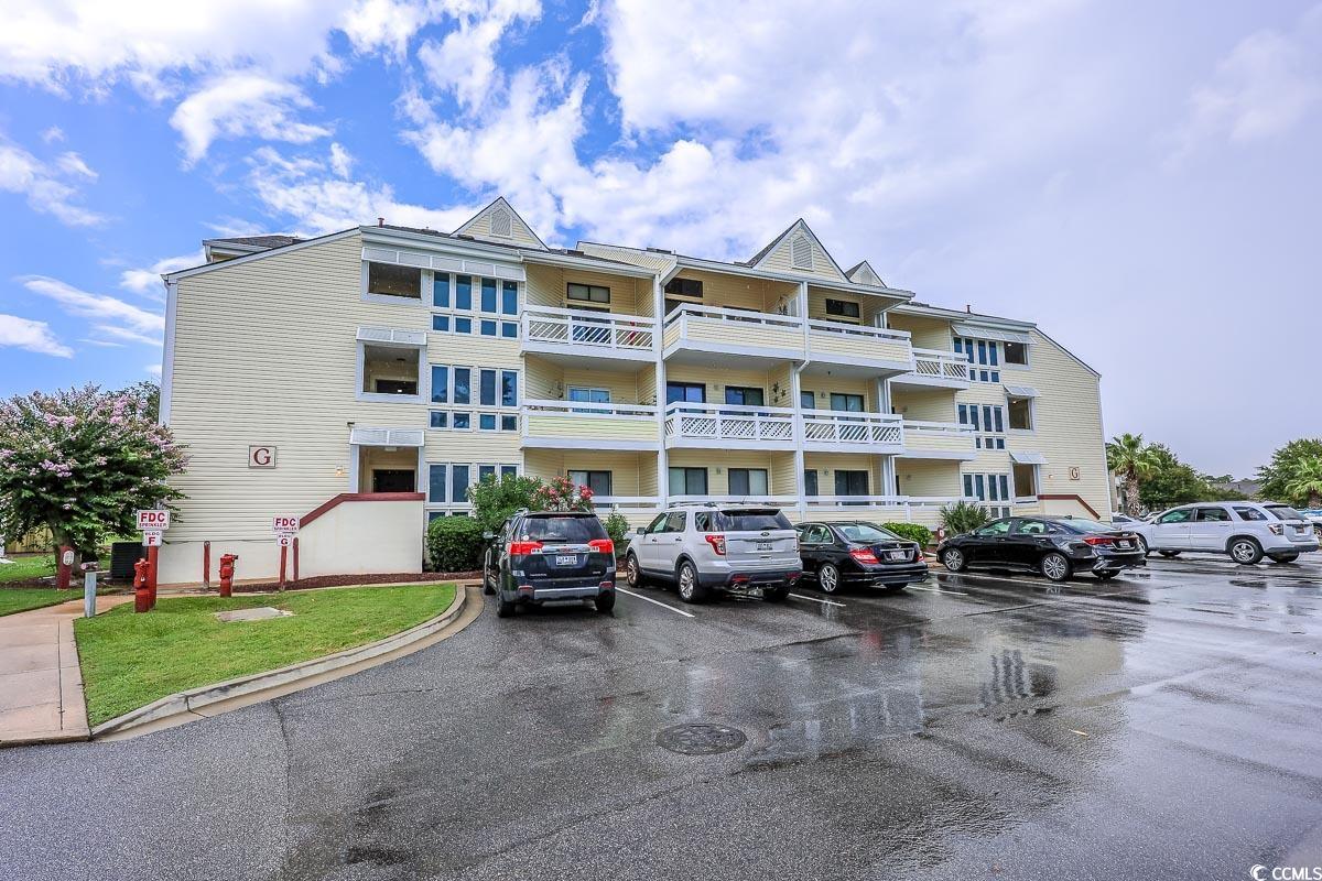 1100 Possum Trot Road, Unit G324 North Myrtle Beach, SC 29582 - Photo 27 of 28 View of building exterior with uncovered parking