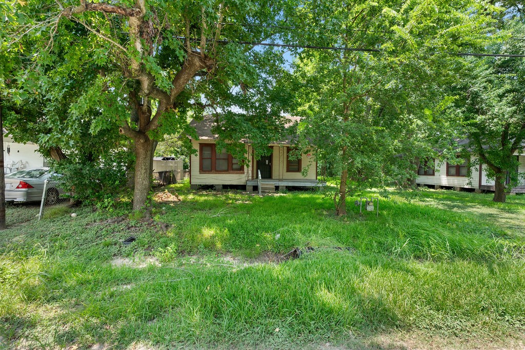 7335 Phillips Street Houston, TX 77088 - Photo 9 of 12 a view of a house with a backyard
