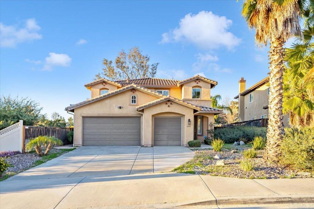 a front view of a house with a garage
