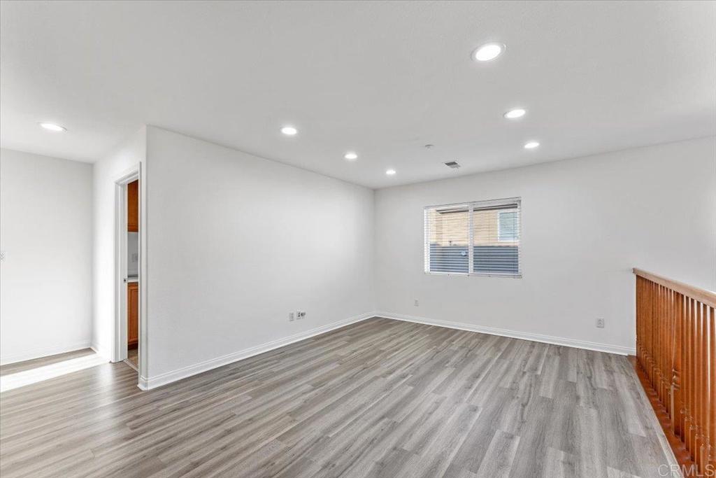 2252 Marquand Court Alpine, CA 91901 - Photo 22 of 45 an empty room with wooden floor and windows