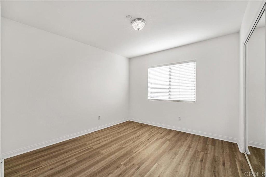 2252 Marquand Court Alpine, CA 91901 - Photo 23 of 45 an empty room with wooden floor and windows