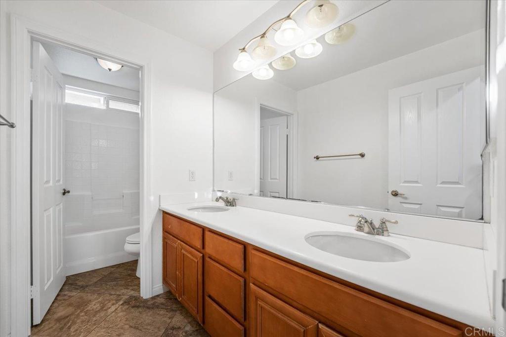 2252 Marquand Court Alpine, CA 91901 - Photo 29 of 45 a bathroom with a sink a vanity and a mirror