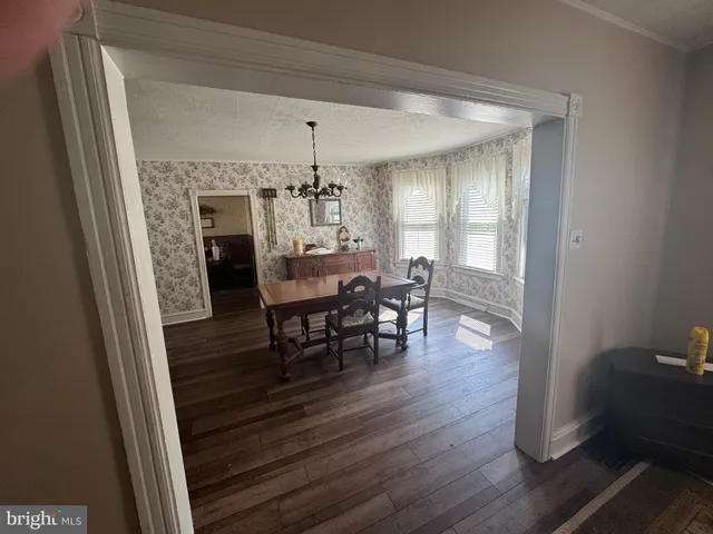 a kitchen with stainless steel appliances granite countertop a refrigerator a sink and a stove