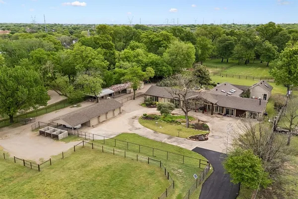 an aerial view of residential house with outdoor space and swimming pool
