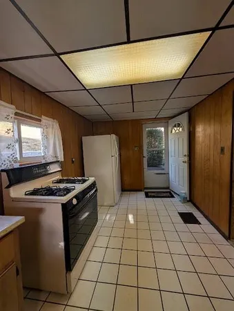 a view of a chairs and table in the patio