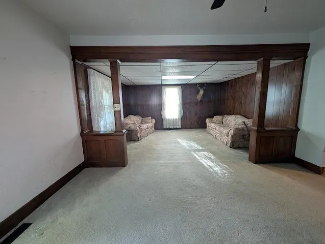 a living room with furniture and a window