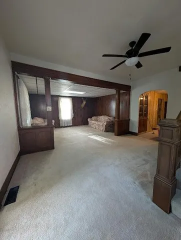 a bedroom with a bed and a car