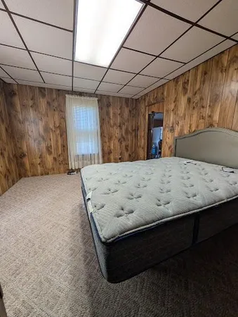 a white toilet sitting next to a shower curtain