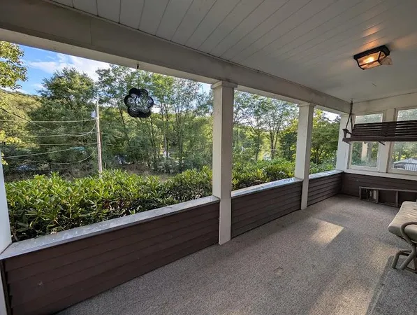 a view of two chairs in the balcony