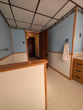 a spacious bedroom with two beds and a window