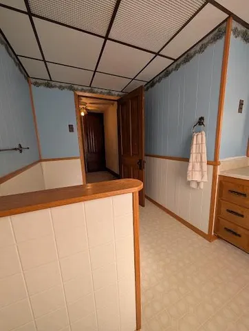 a spacious bedroom with two beds and a window