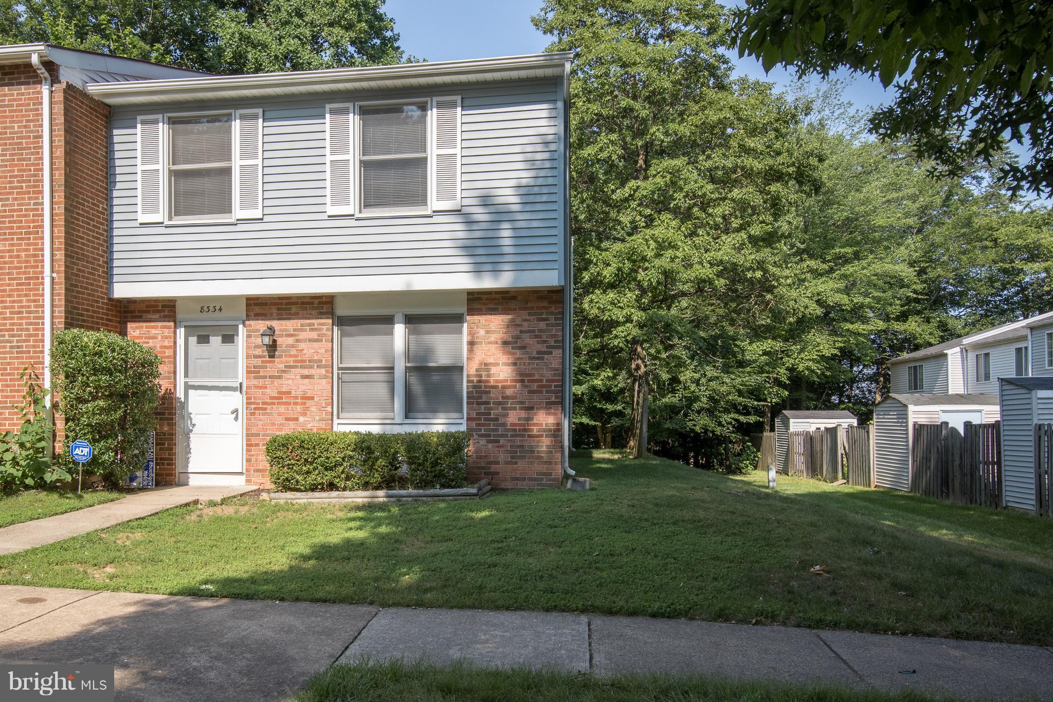 a view of a house with a yard and plants